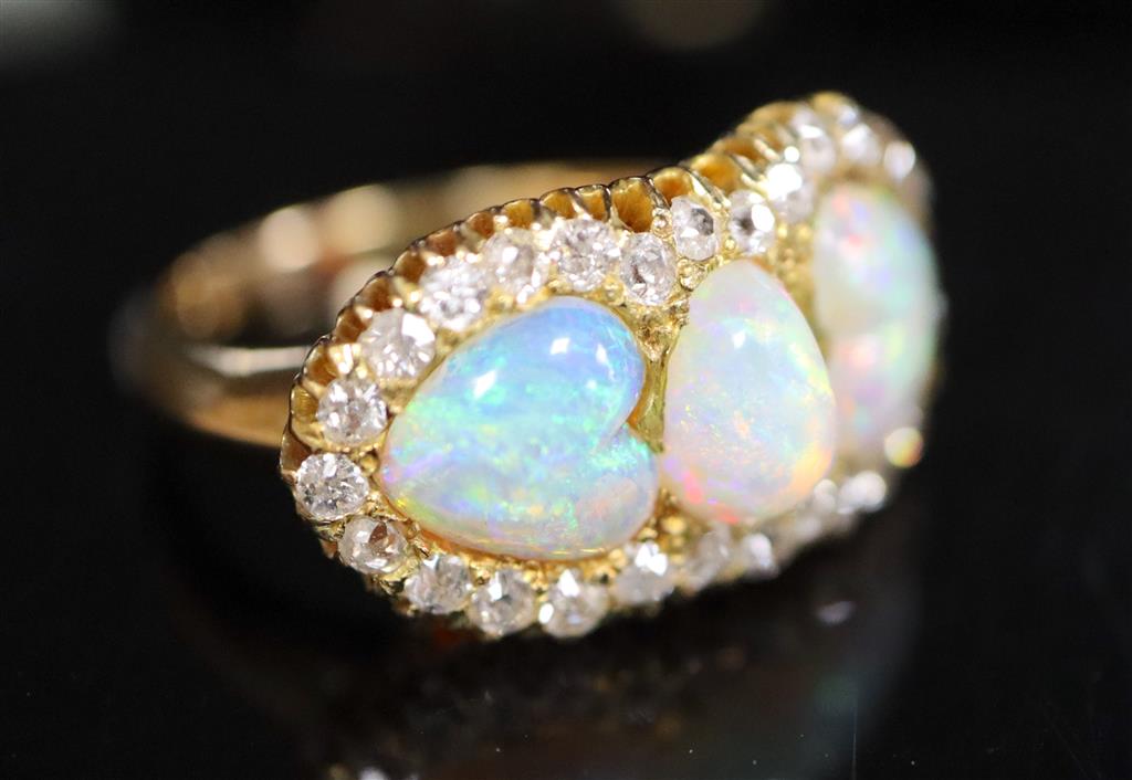 A gold, three stone white opal and diamond set cluster ring,